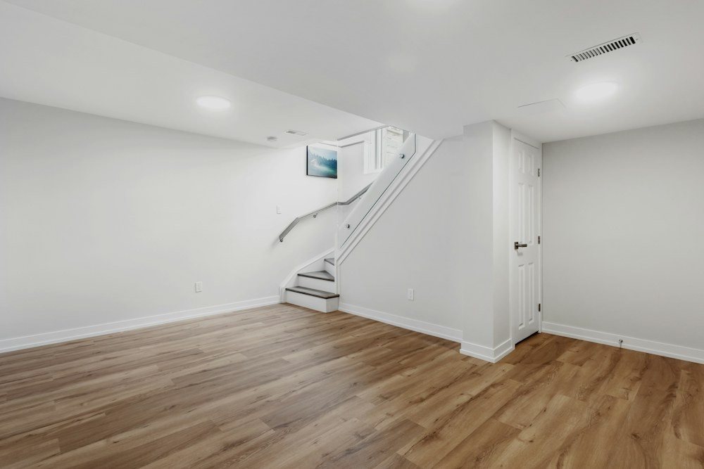 A dry, carpeted finished basement with a sealed perimeter